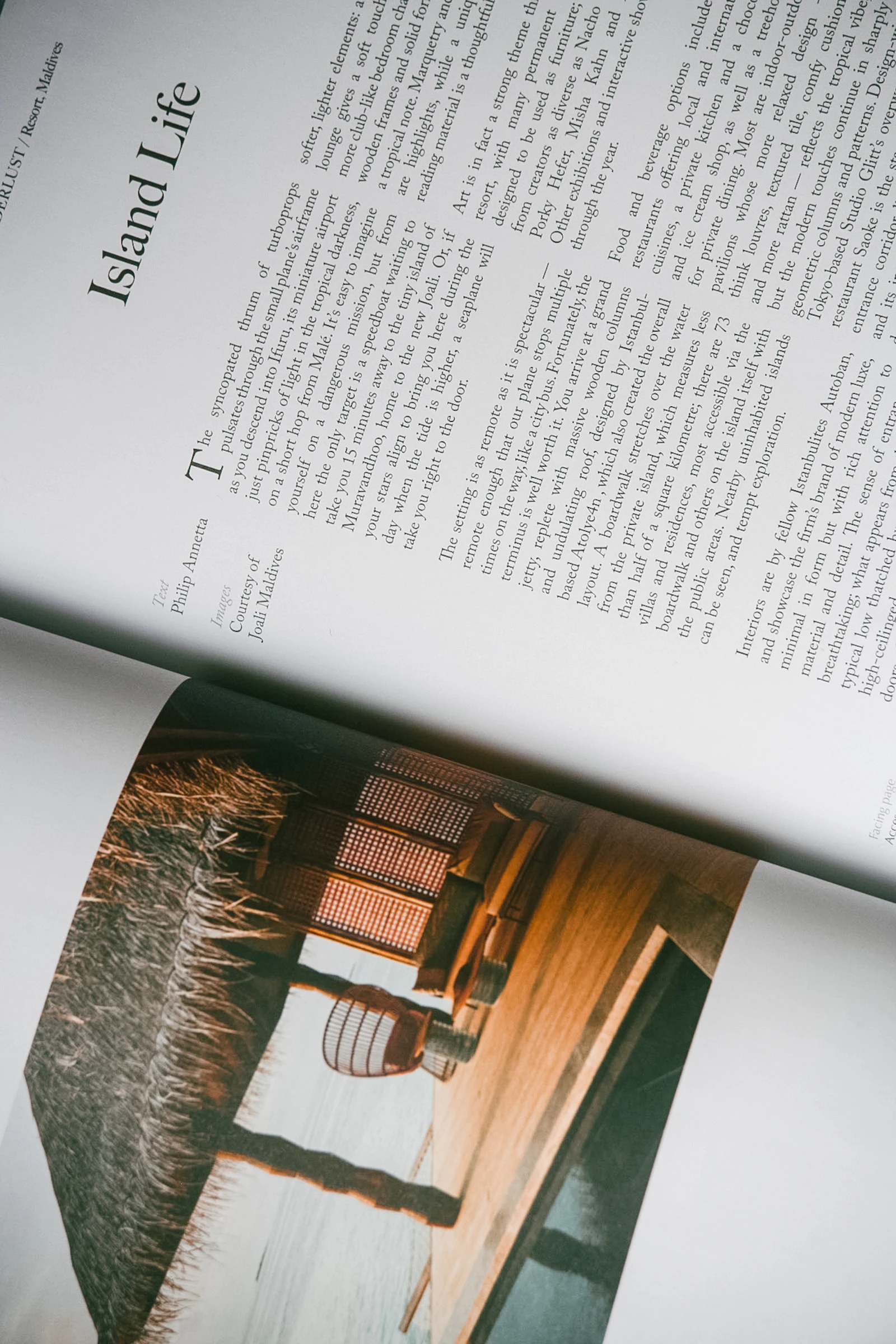An open book showing a full-page photograph of a chair