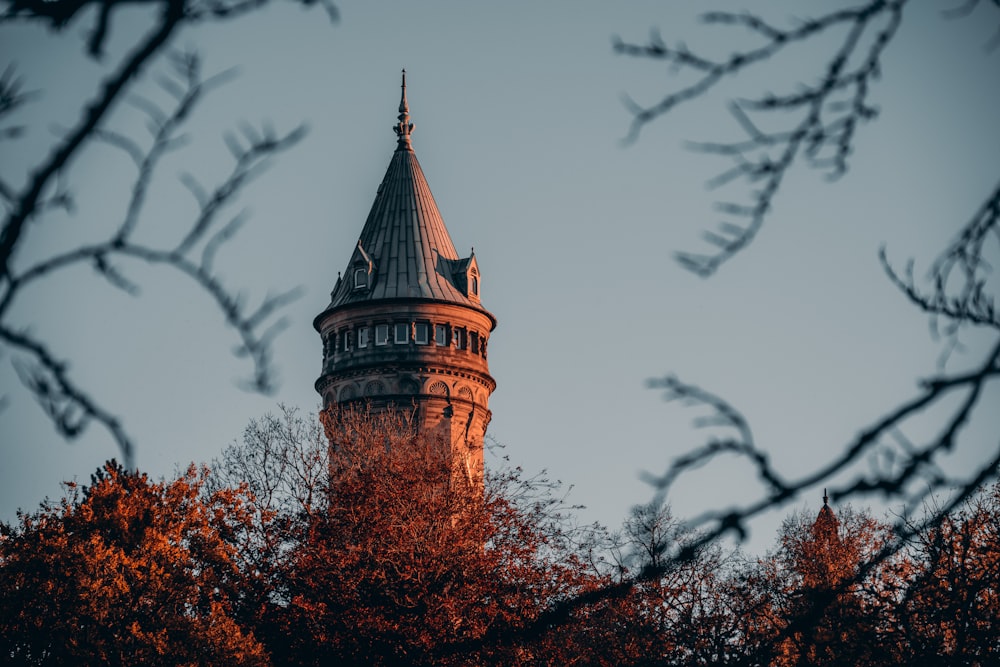 a tall tower with a clock on the top of it