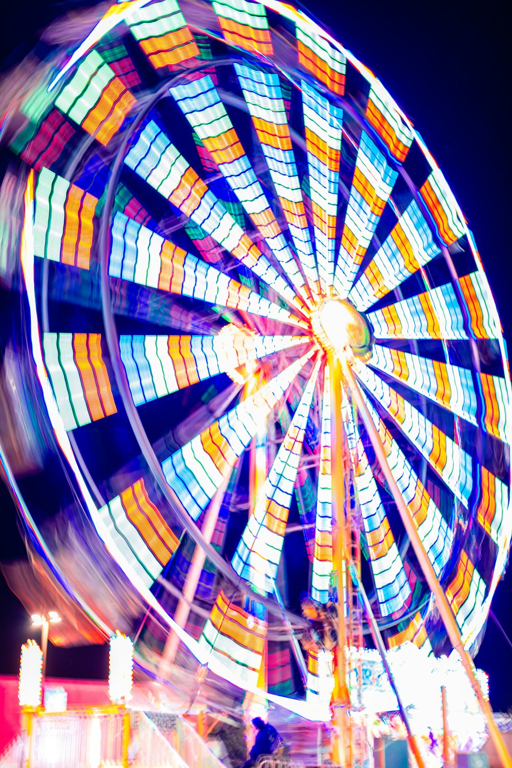 a ferris wheel at a carnival at night