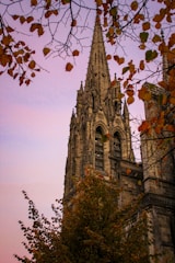 a very tall building with a clock on it's side