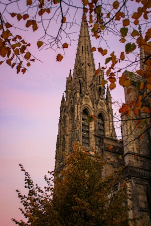 a very tall building with a clock on it's side