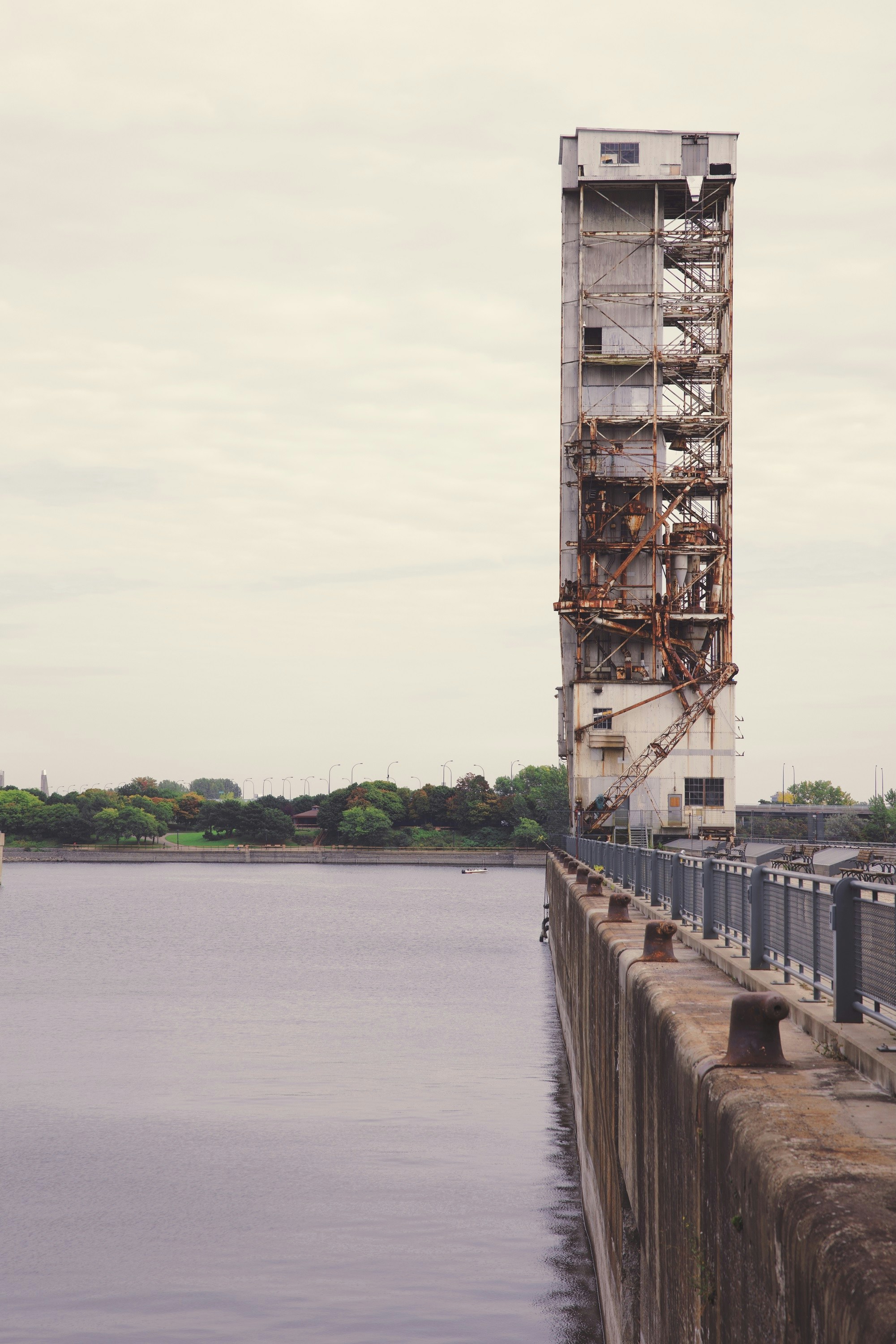 a tall tower next to a body of water