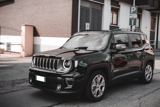 a black jeep parked on the side of the road