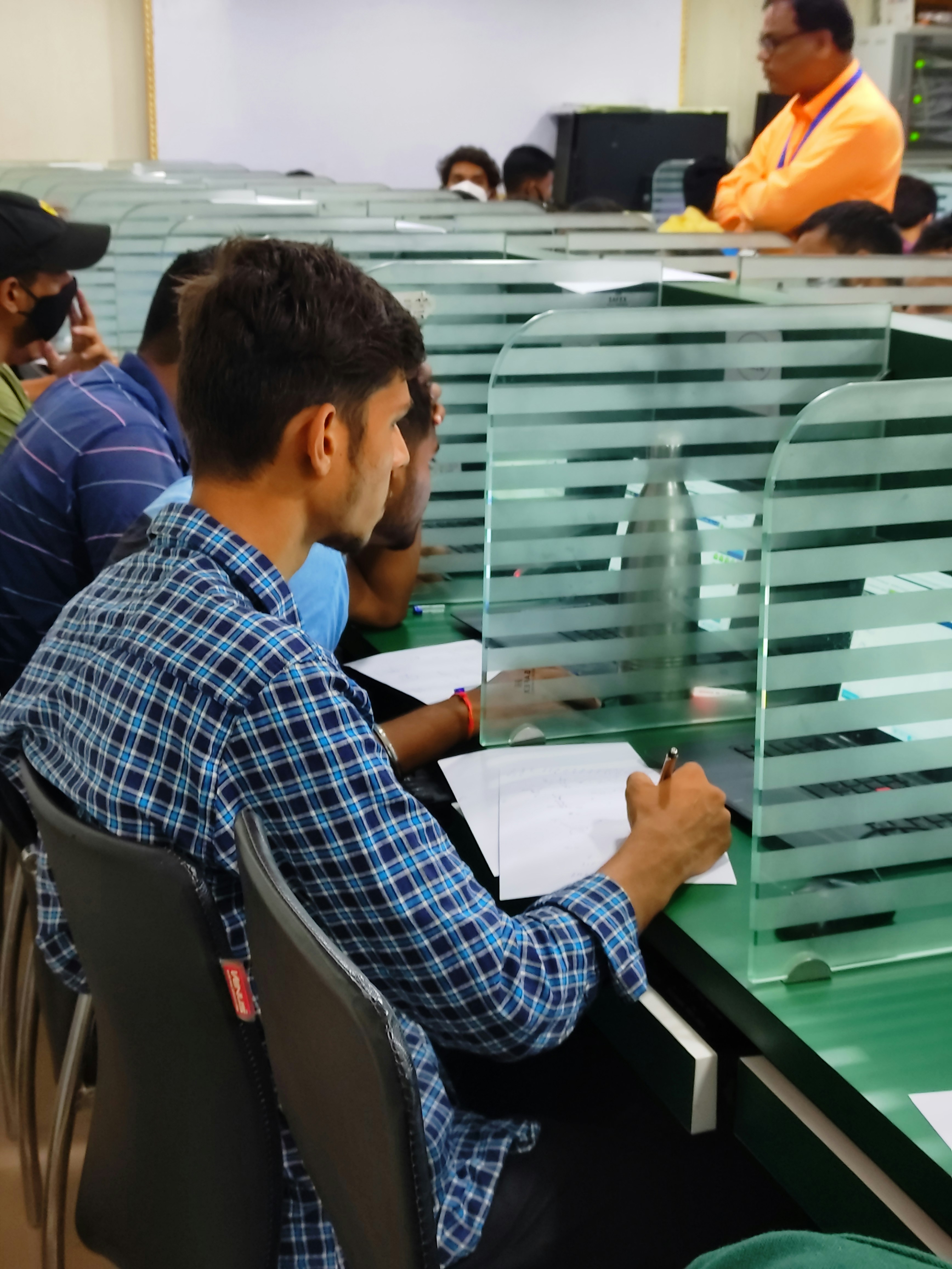 a group of men sitting at a table with papers