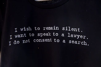 a black t - shirt with a poem written on it
