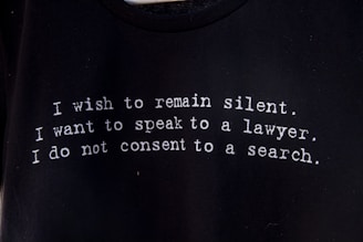 a black t - shirt with a poem written on it