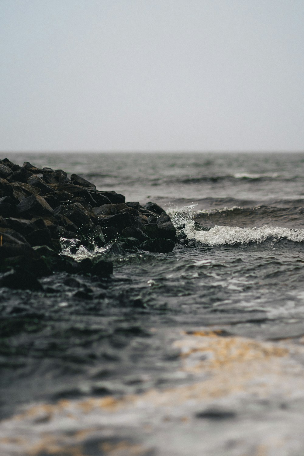 a person riding a surfboard on top of a wave