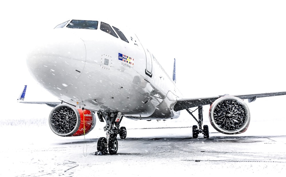 a large jetliner sitting on top of an airport tarmac