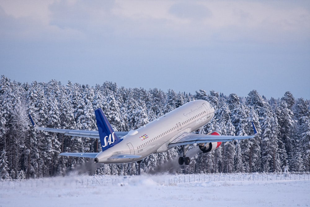 a large jetliner taking off from an airport runway