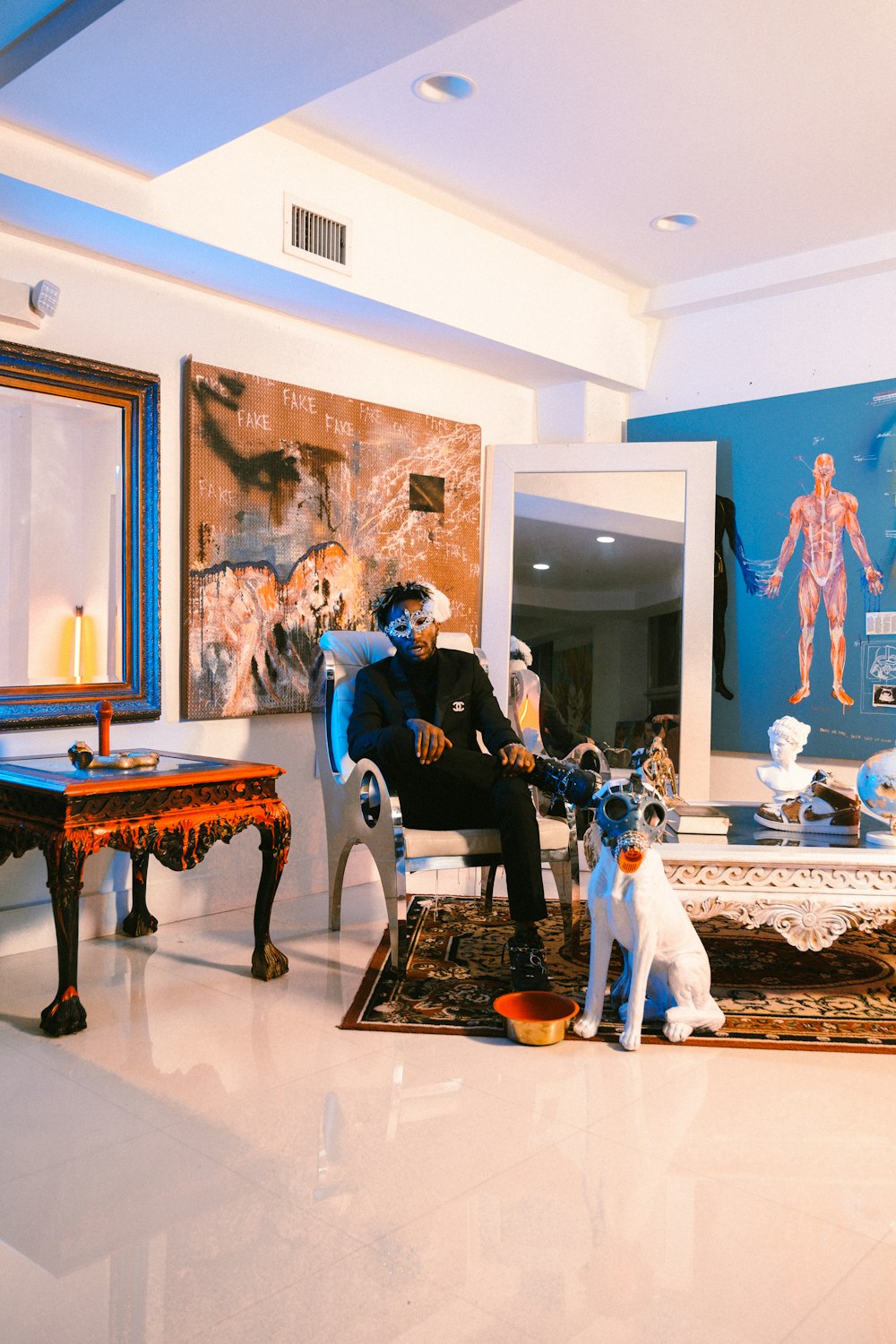 a man sitting in a chair in a living room