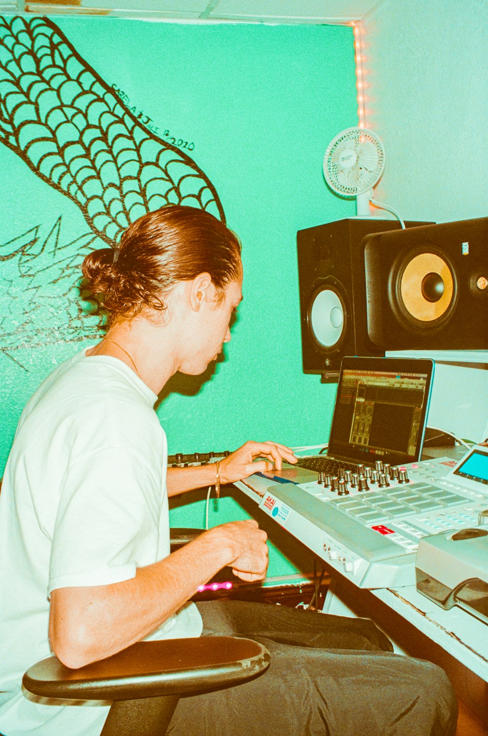 a man sitting in front of a laptop computer