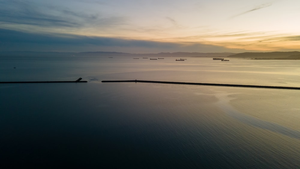 a large body of water with a sky background