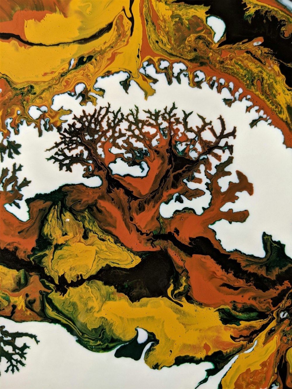 an abstract painting of a tree in yellow and orange
