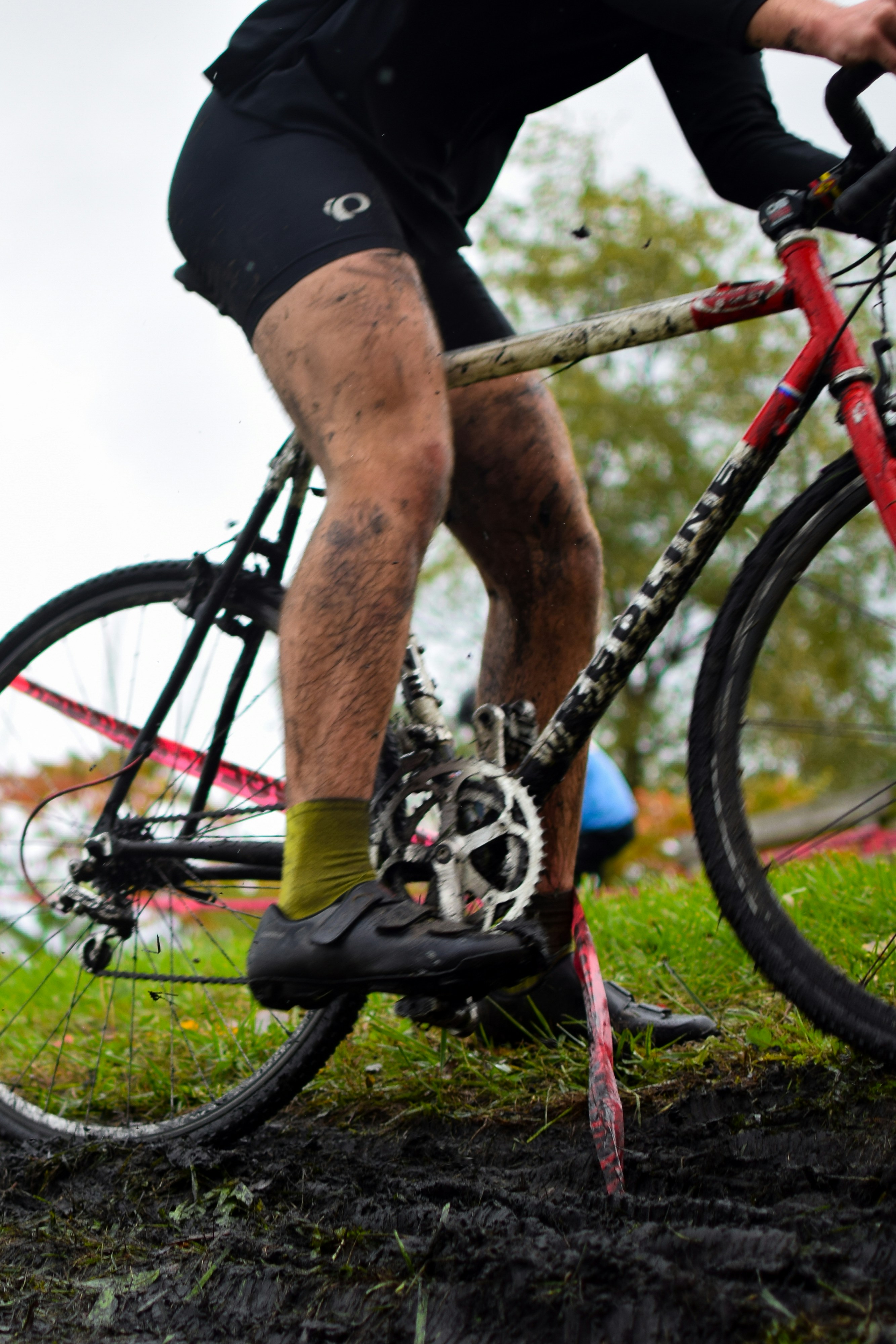 a man riding a bike on top of a lush green field