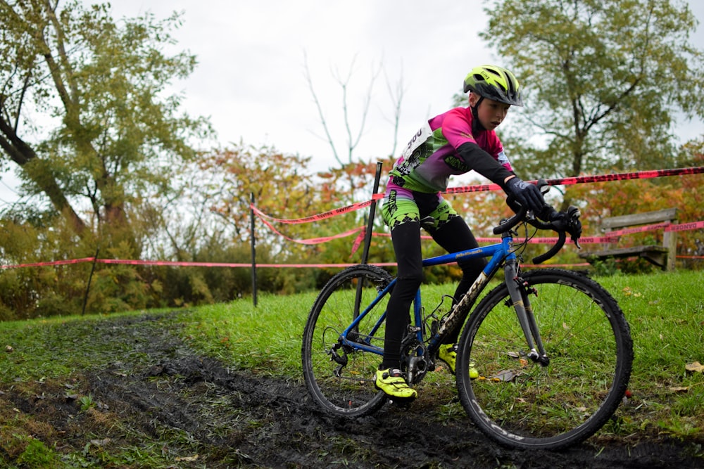 a man riding on the back of a bicycle