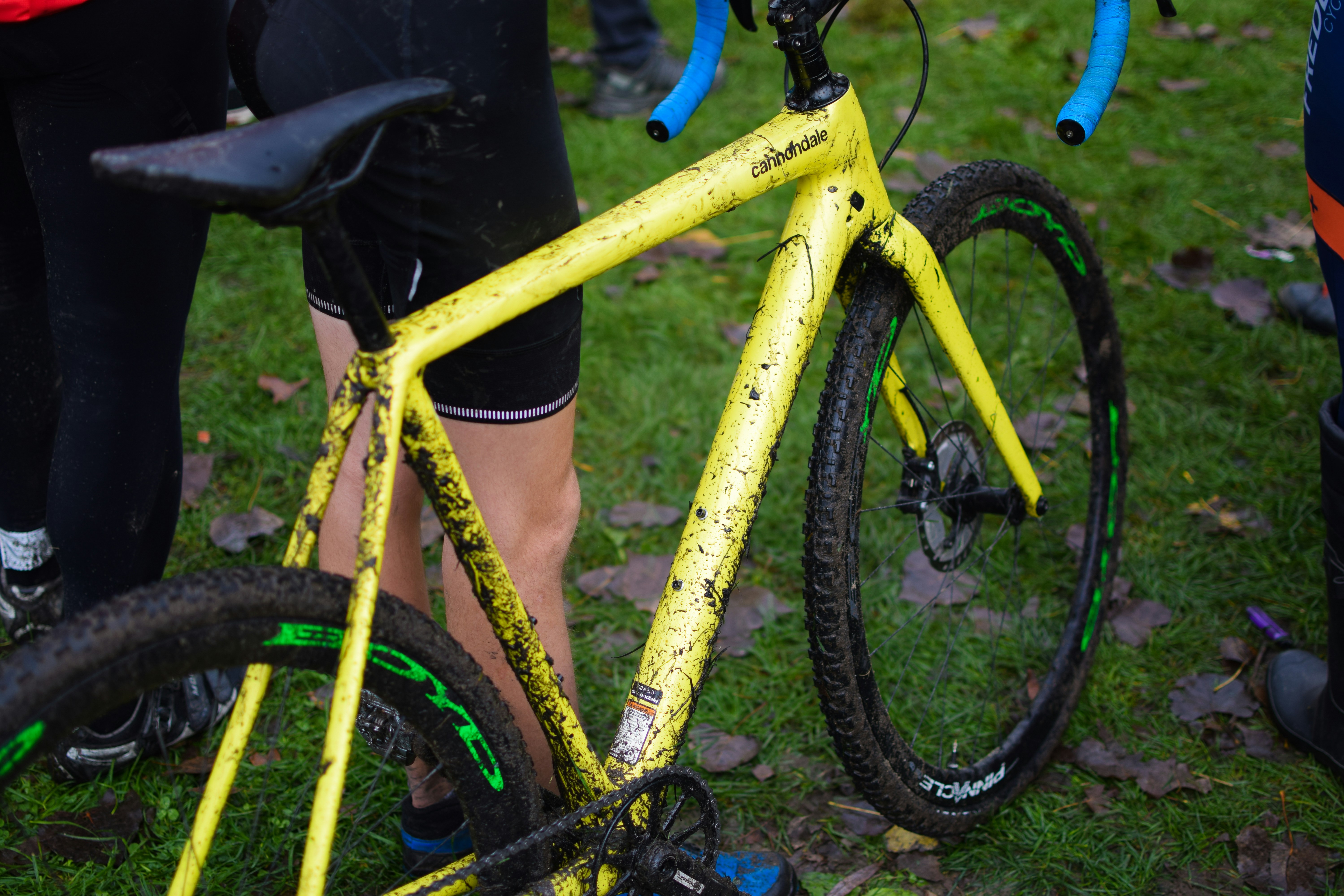 a person holding a bicycle