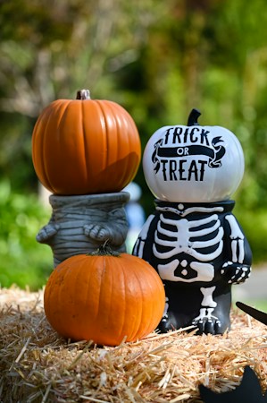 Stacked Halloween pumpkins with a trick or treat message, the kind of decor families will see at free trunk-or-treat events in east Las Vegas