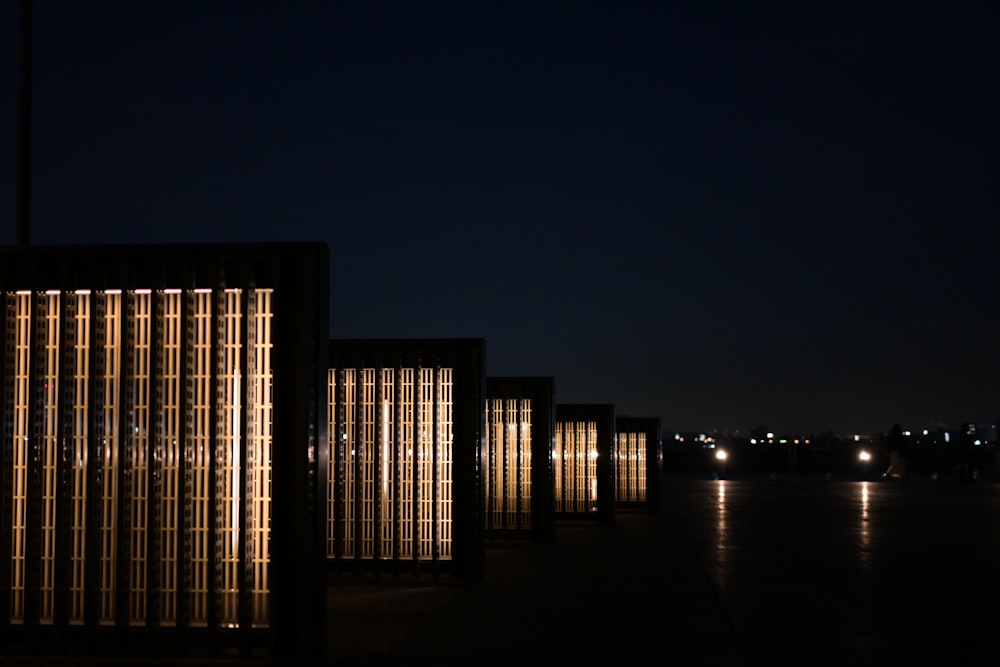 a row of buildings lit up at night