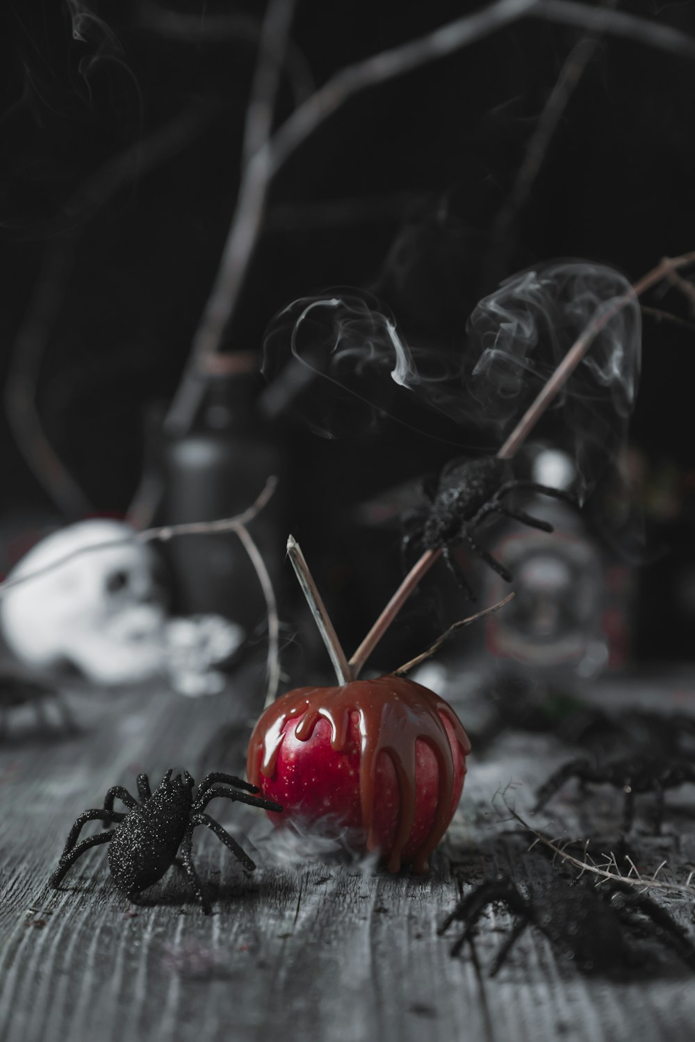 a red apple sitting on top of a wooden table