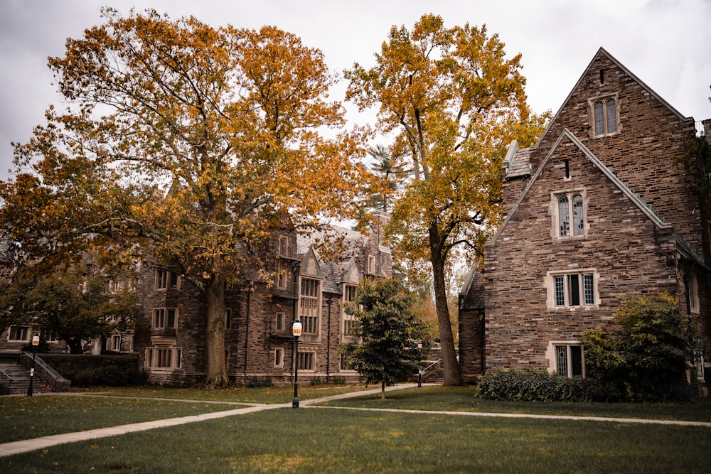 a stone building with trees in front of it