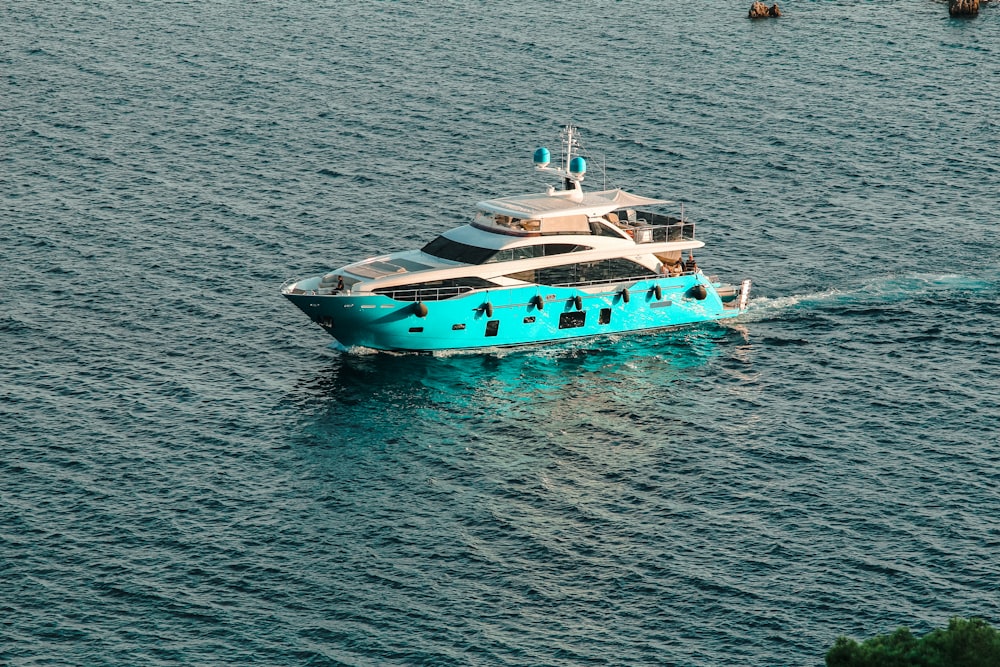 a large blue boat in the middle of a body of water