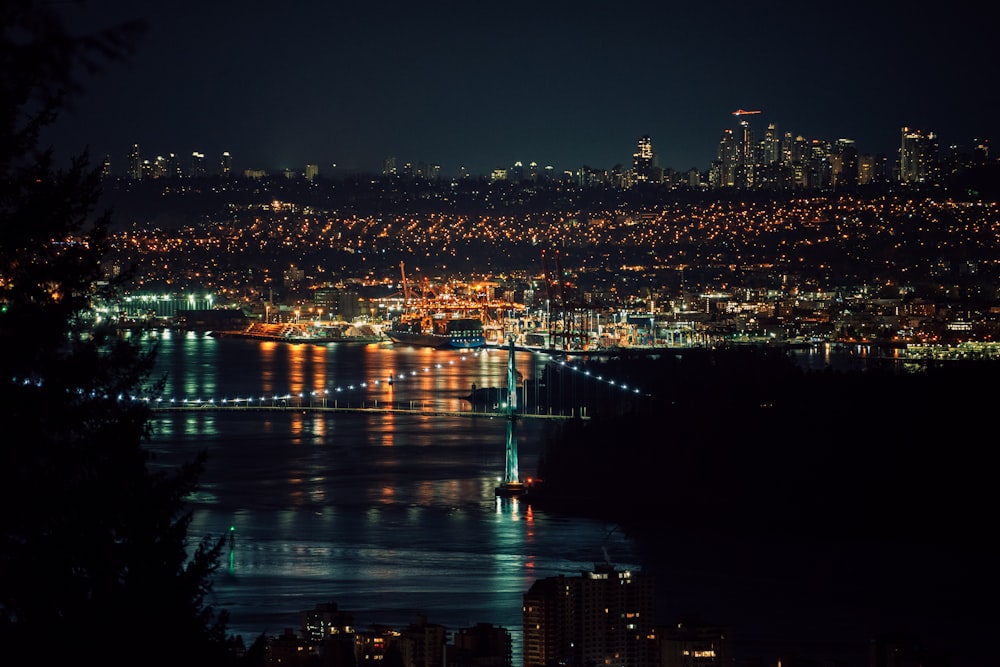 a view of a city at night from a hill