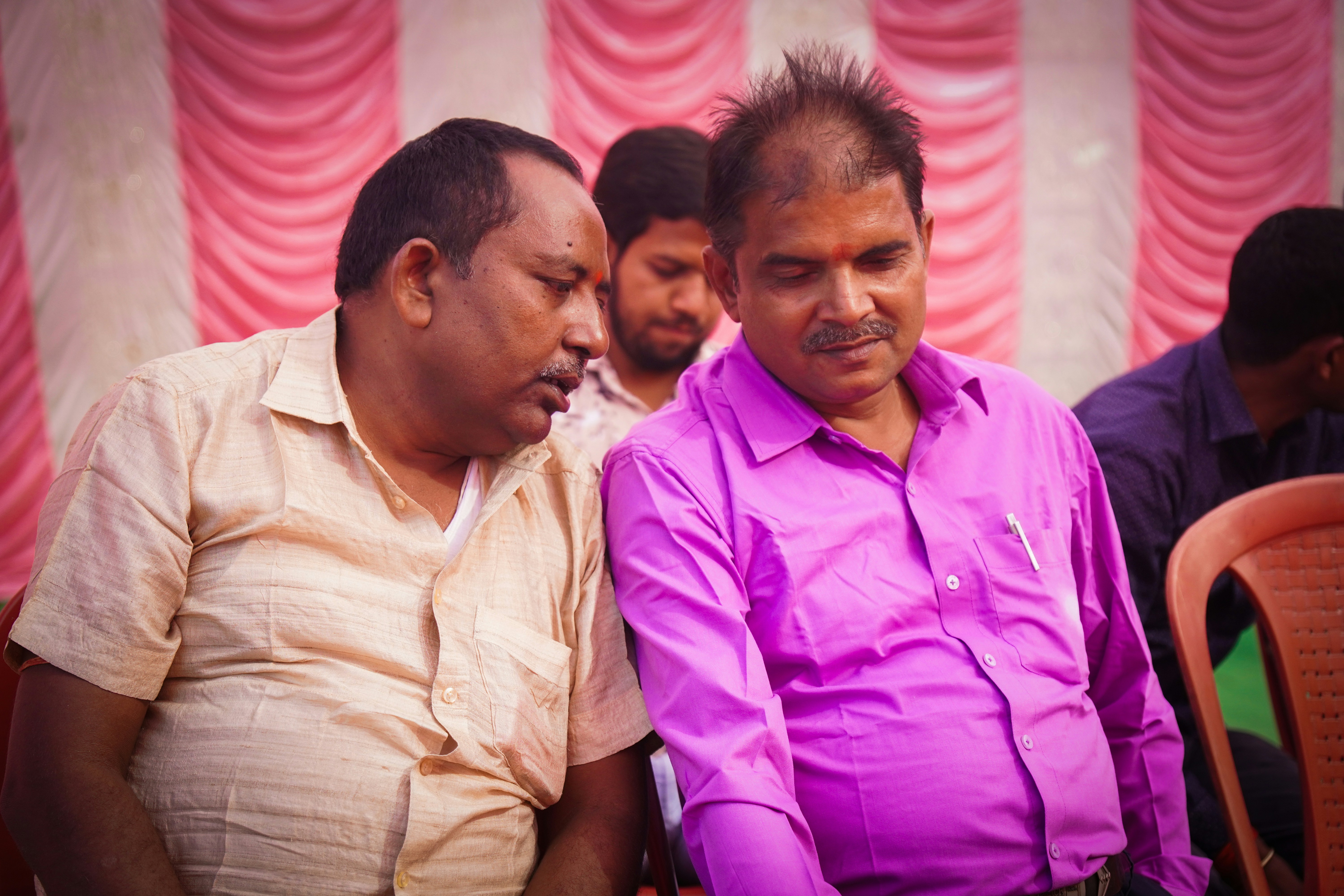 A split image showing Jairam Ramesh speaking passionately on one side and Bhupender Yadav listening intently on the other, symbolizing their confrontation.