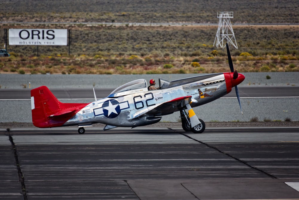 a small airplane sitting on top of an airport runway