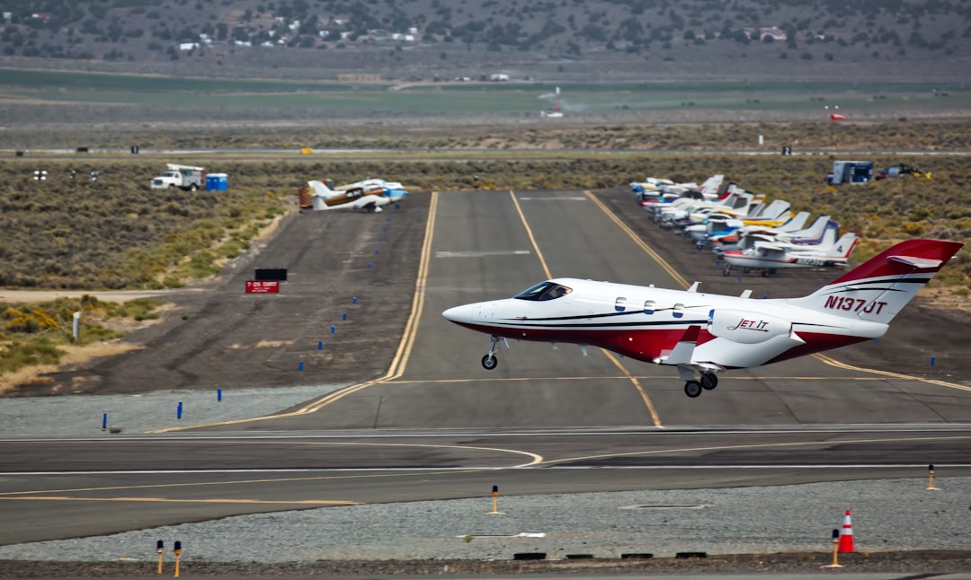 a small plane taking off from an airport runway, Private jet