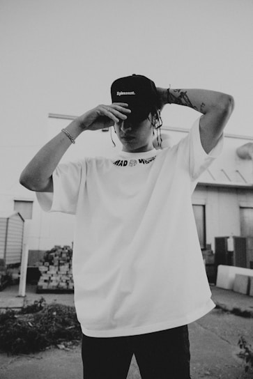 a young man with a hat on his head