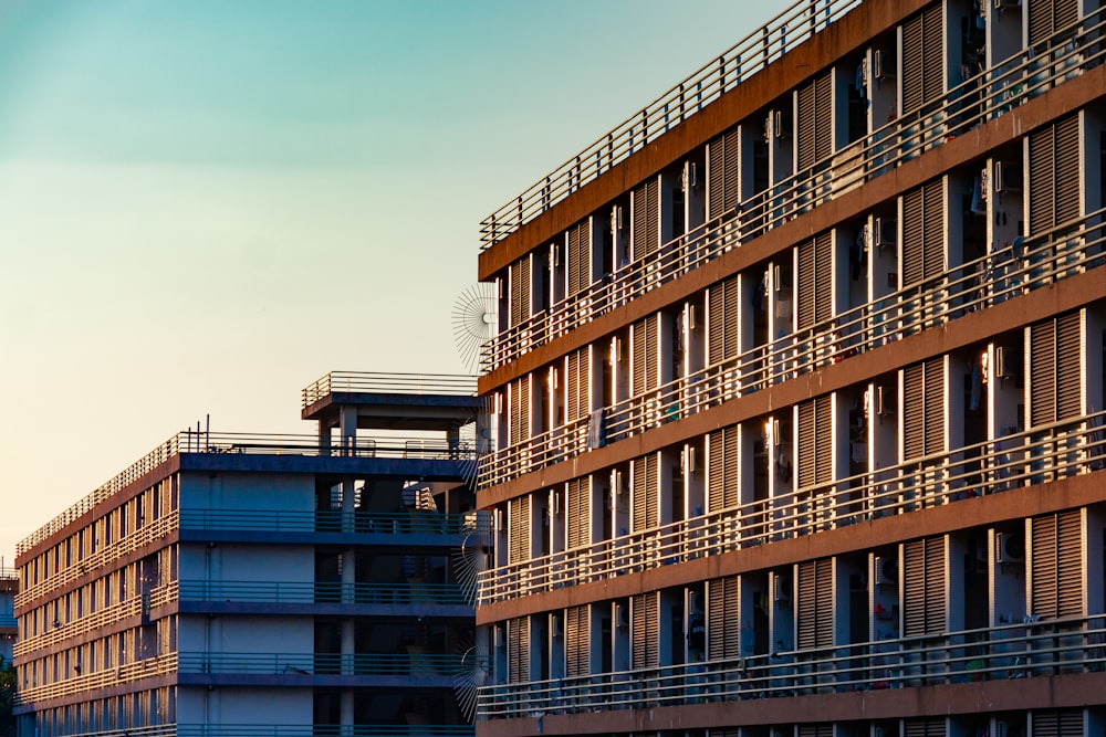 a tall building with balconies next to it