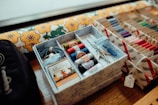 a box filled with lots of different types of thread