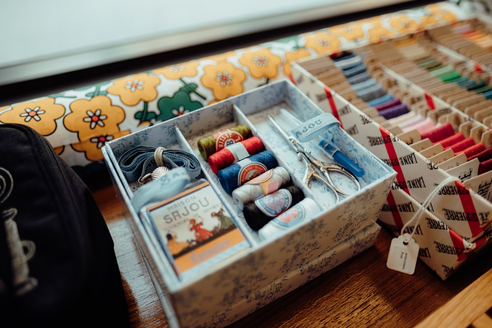 a box filled with lots of different types of thread