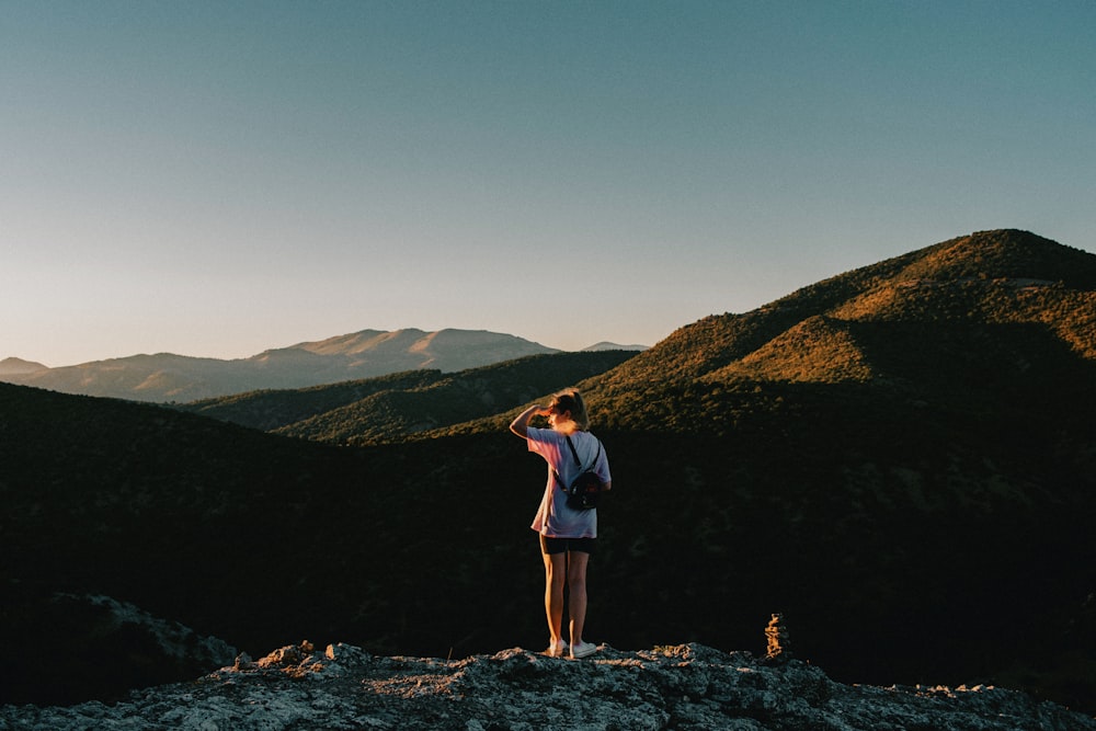 a person standing on top of a mountain