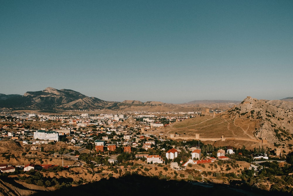 a view of a small town in the mountains