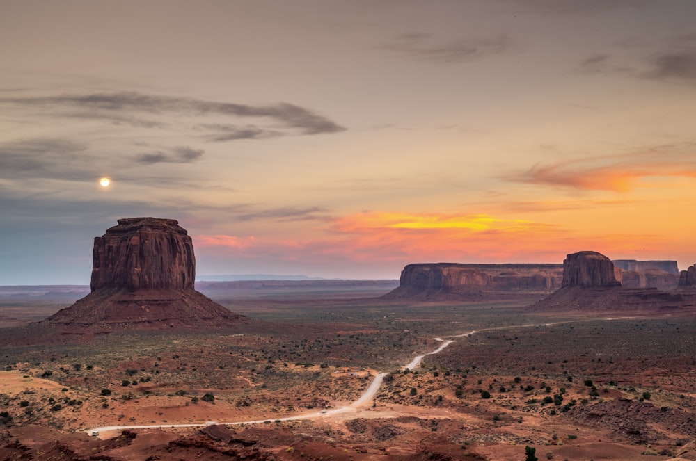 a desert landscape with a river running through it