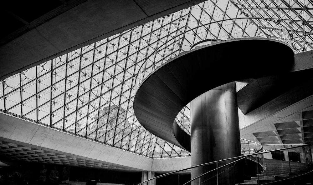 a black and white photo of a staircase in a building