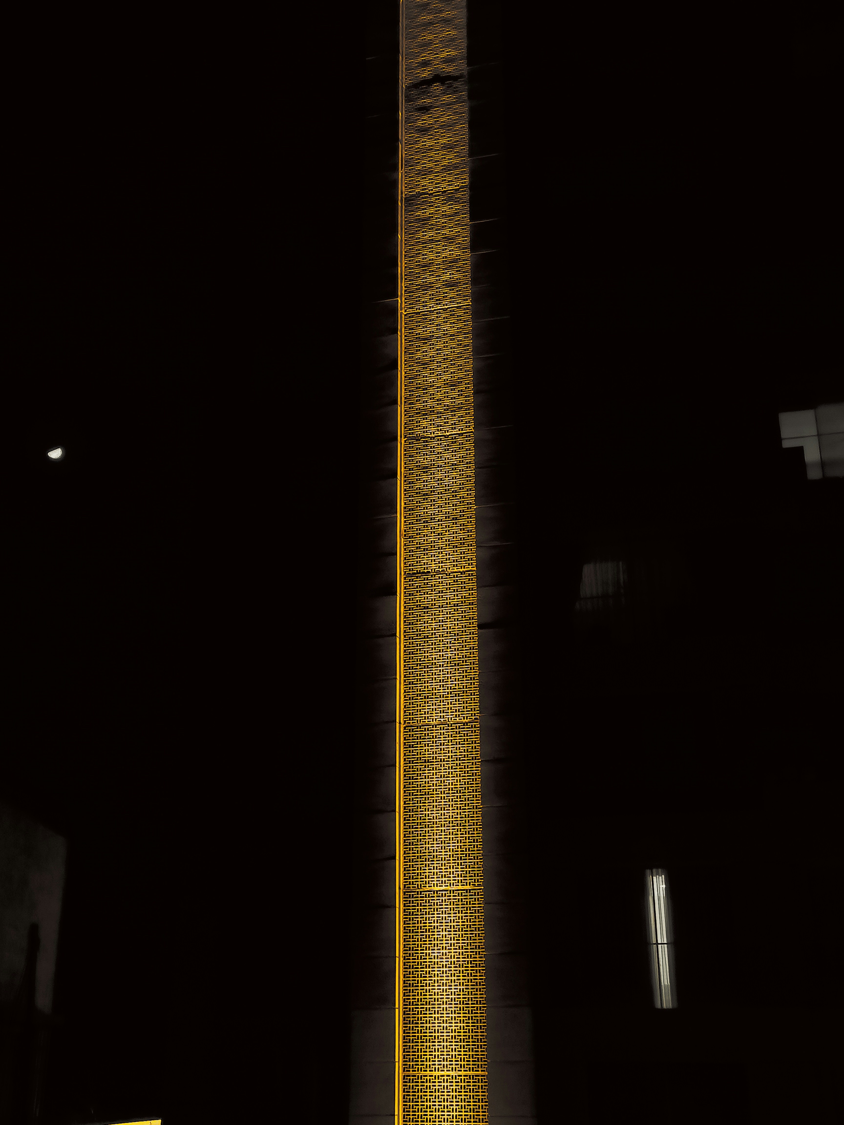 a tall clock tower lit up at night