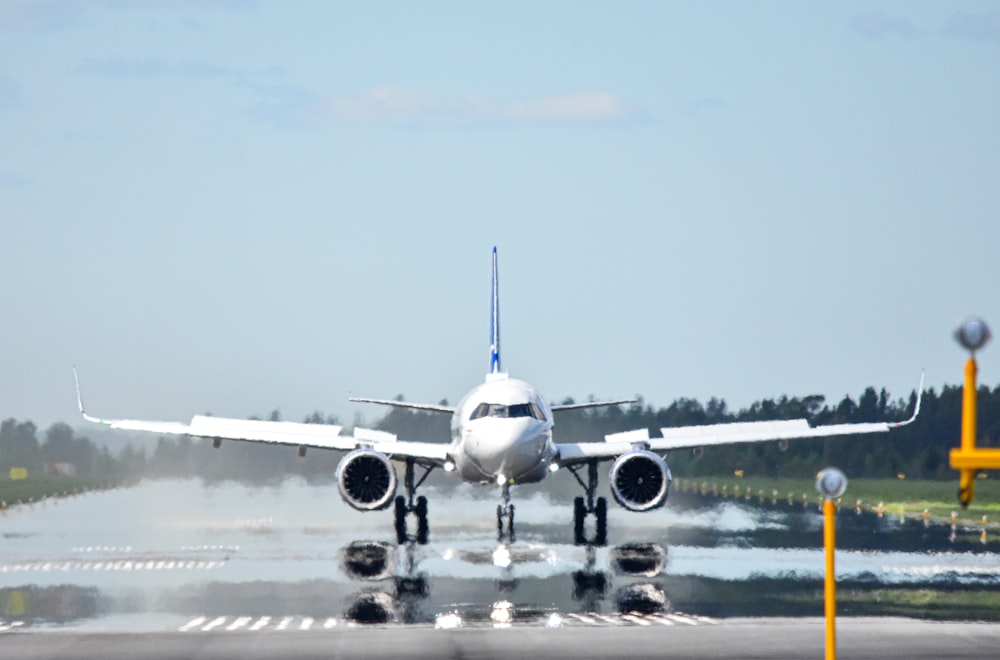 a large jetliner taking off from an airport runway