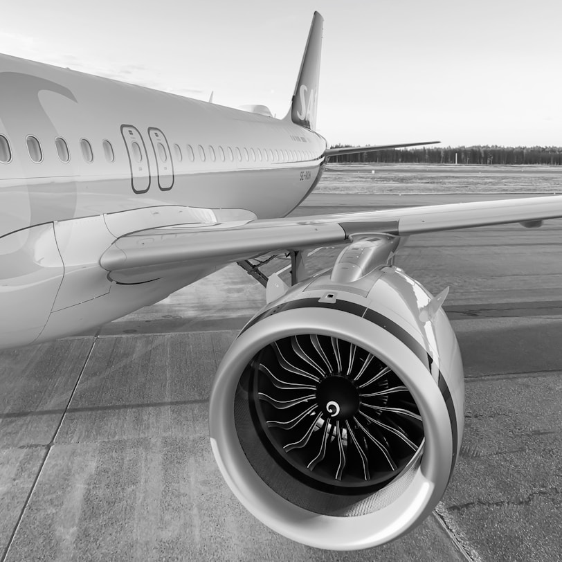 a jet engine sitting on top of an airport tarmac