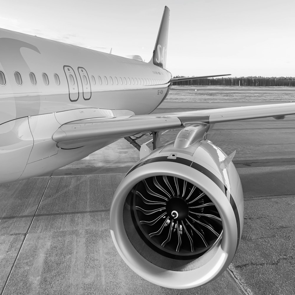 a jet engine sitting on top of an airport tarmac
