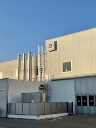 a building with a lot of pipes and windows