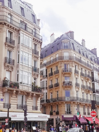 A charming Parisian street with boutique shops and locals walking, capturing the city's authentic vibe.