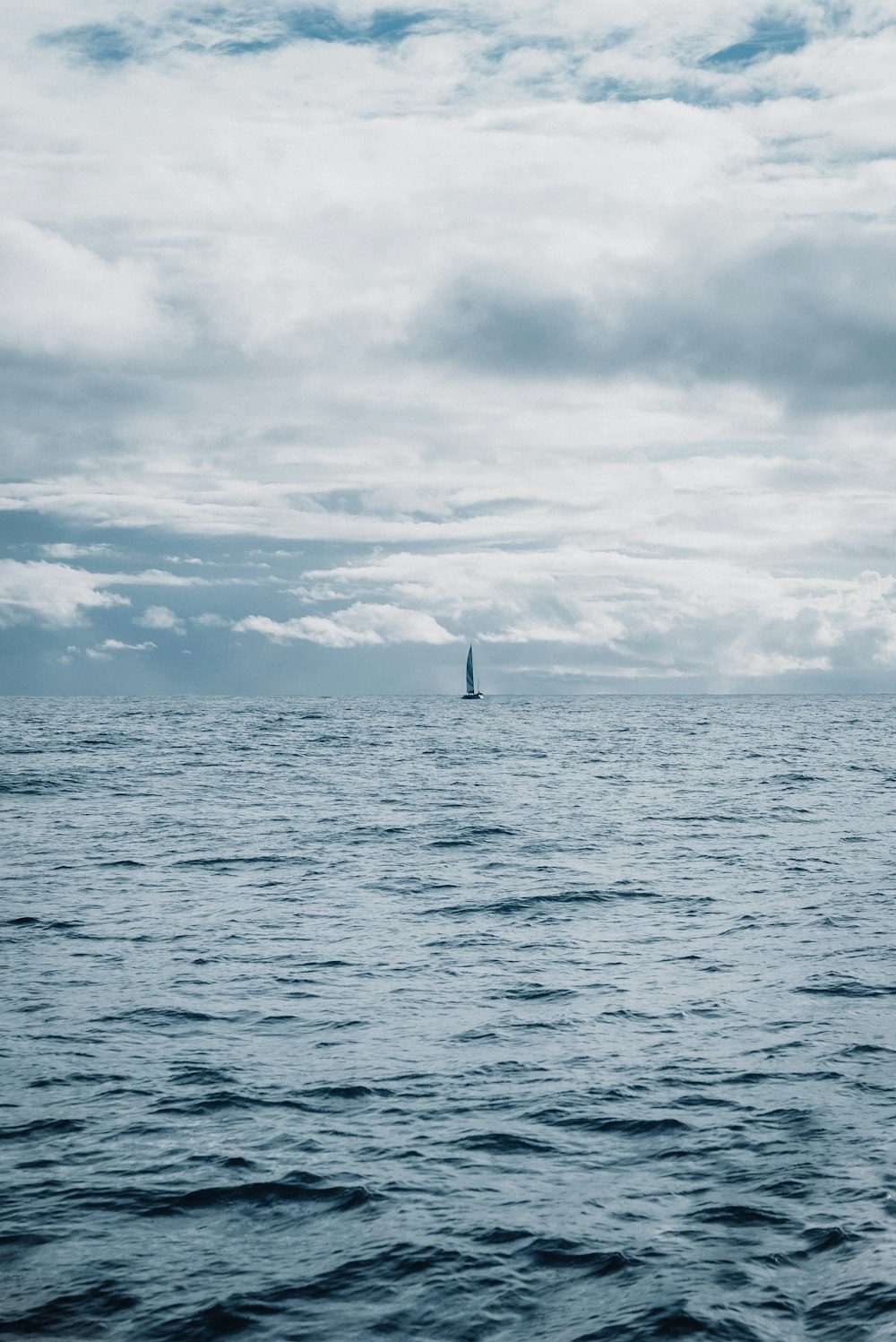 a sailboat in the middle of a large body of water