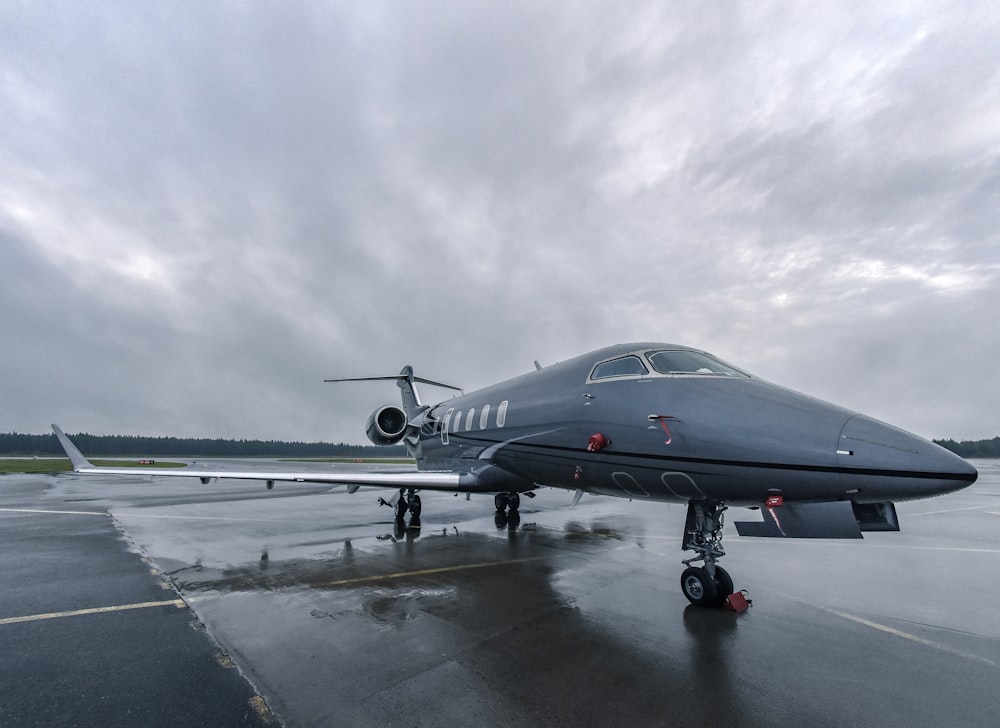 a jet sitting on top of an airport tarmac