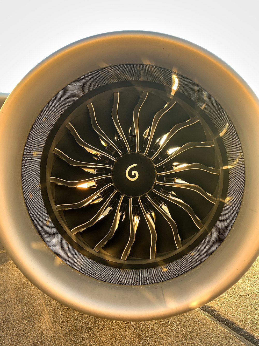 a close up of a jet engine on a runway