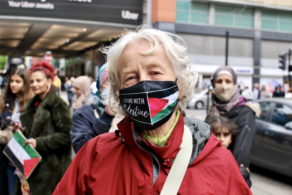 a woman wearing a face mask with a flag on it