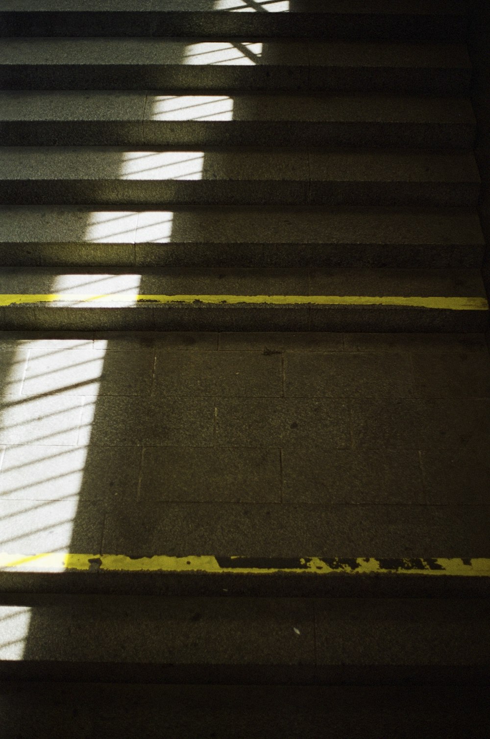 a stair case with a yellow line painted on it
