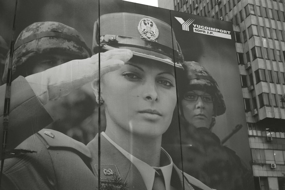 a large poster of a woman in uniform