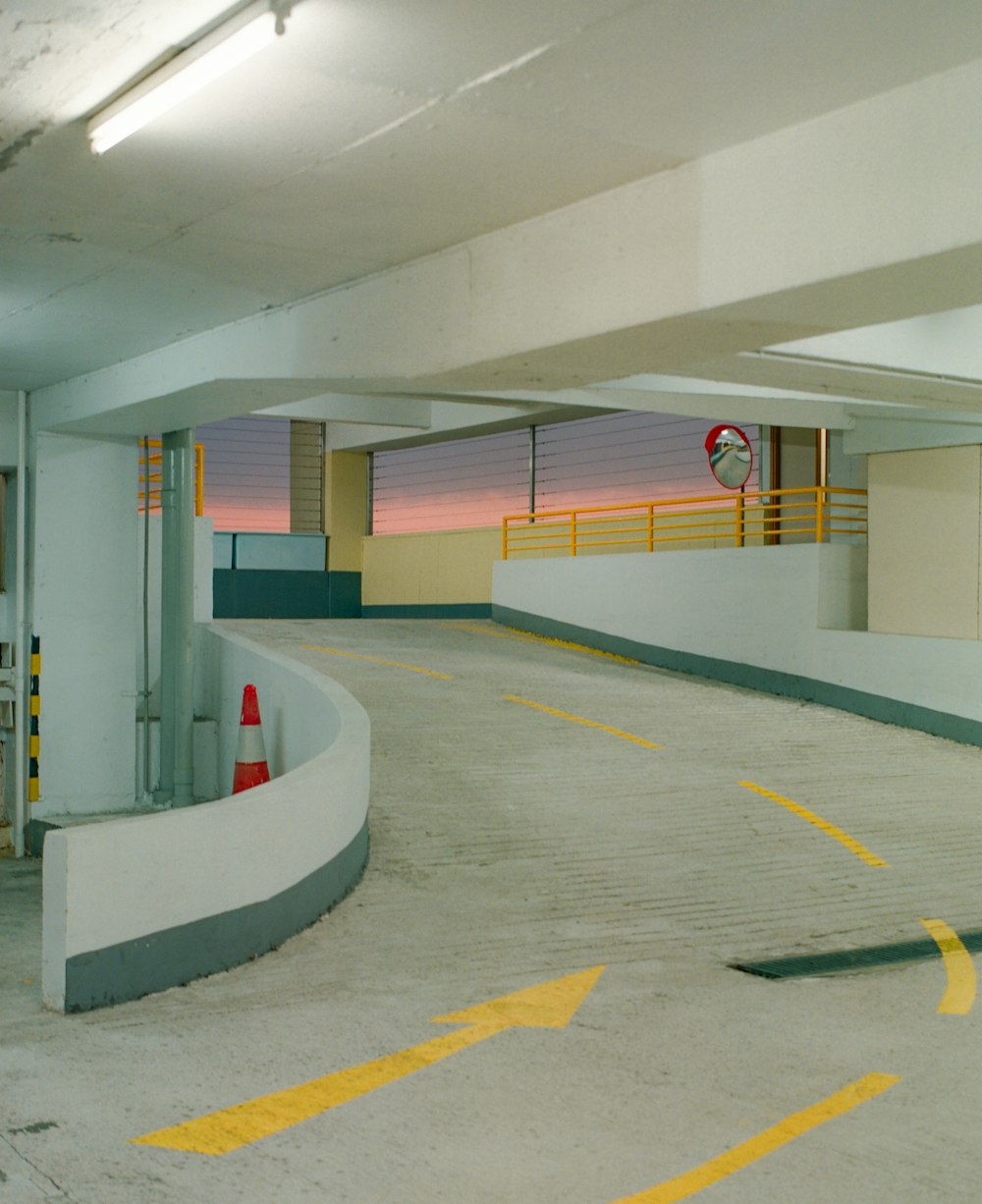 an empty parking garage with a fire hydrant